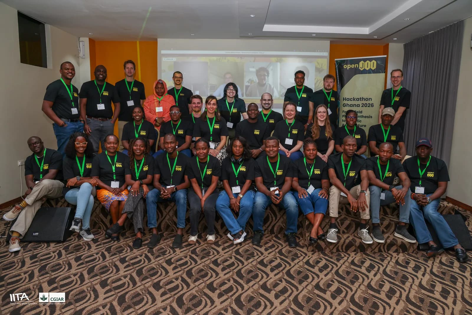 The 35 hackathon participants posing together in front of the openJII Hackathon Ghana 2026 banner, with IITA and CGIAR branding visible